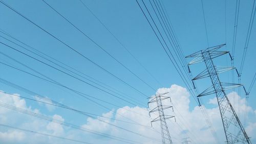 Low angle view of electricity pylon against sky