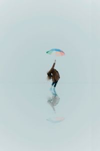 Man feeding against white background