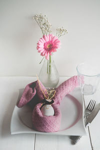 Close-up of pink roses in vase on table