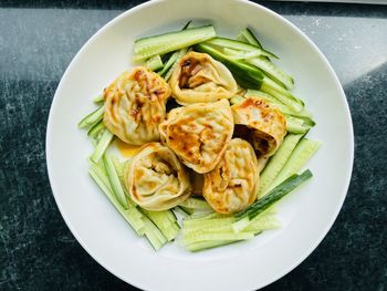 High angle view of delicious dumplings in plate on table