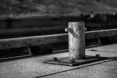 Close-up of cleat at harbor