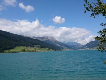 Scenic view of mountains against cloudy sky