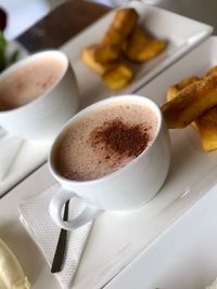 Close-up of coffee cup in plate