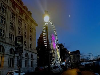 Low angle view of illuminated buildings at night