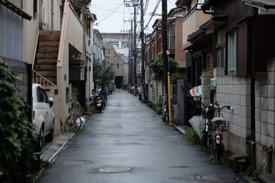 Alley amidst buildings in city