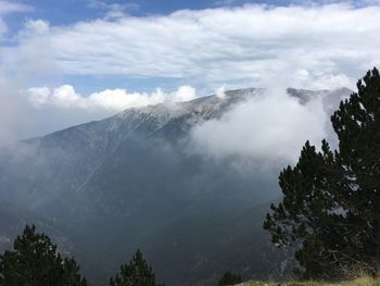 Scenic view of clouds over mountain