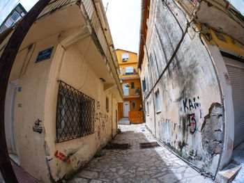 Narrow alley amidst buildings in town