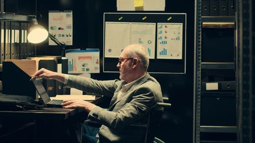 Man using laptop at home