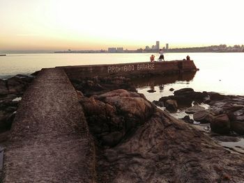 Scenic view of sea against clear sky during sunset
