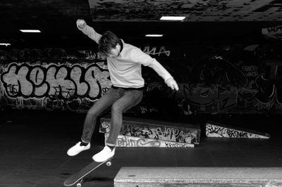 Man performing stunt while skateboarding