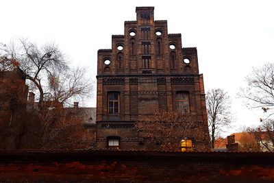 Low angle view of clock tower against sky