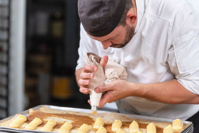 Chef preparing sweet food in commercial kitchen