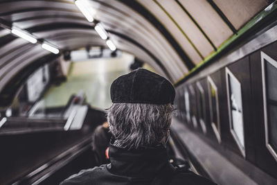 Rear view of man in bus