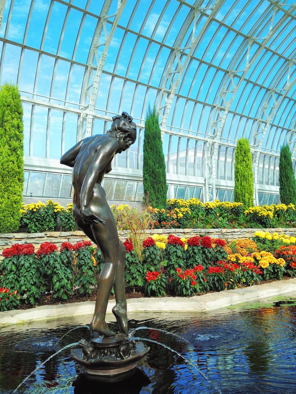 statue, sculpture, human representation, art, art and craft, flower, creativity, fountain, plant, park - man made space, water, built structure, architecture, formal garden, animal representation, tree, growth, building exterior