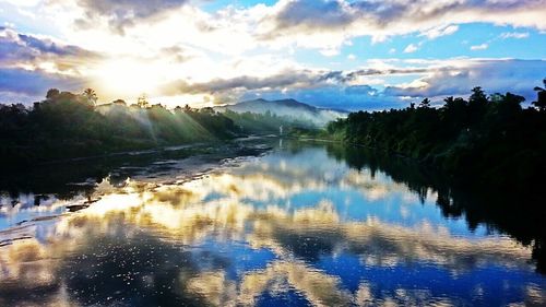 Scenic view of lake against cloudy sky