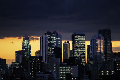 View of skyscrapers lit up at night