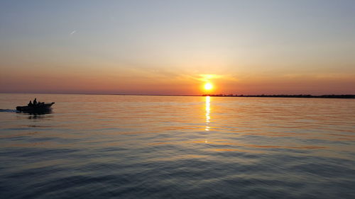 Scenic view of sea at sunset