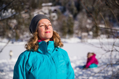 Portrait of woman in snow during winter