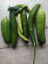 Close-up of green chili peppers on table