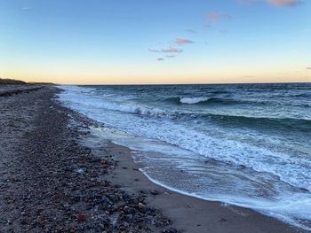 Scenic view of sea against sky during sunset