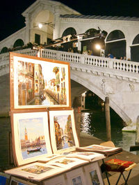 Arch bridge over river in city