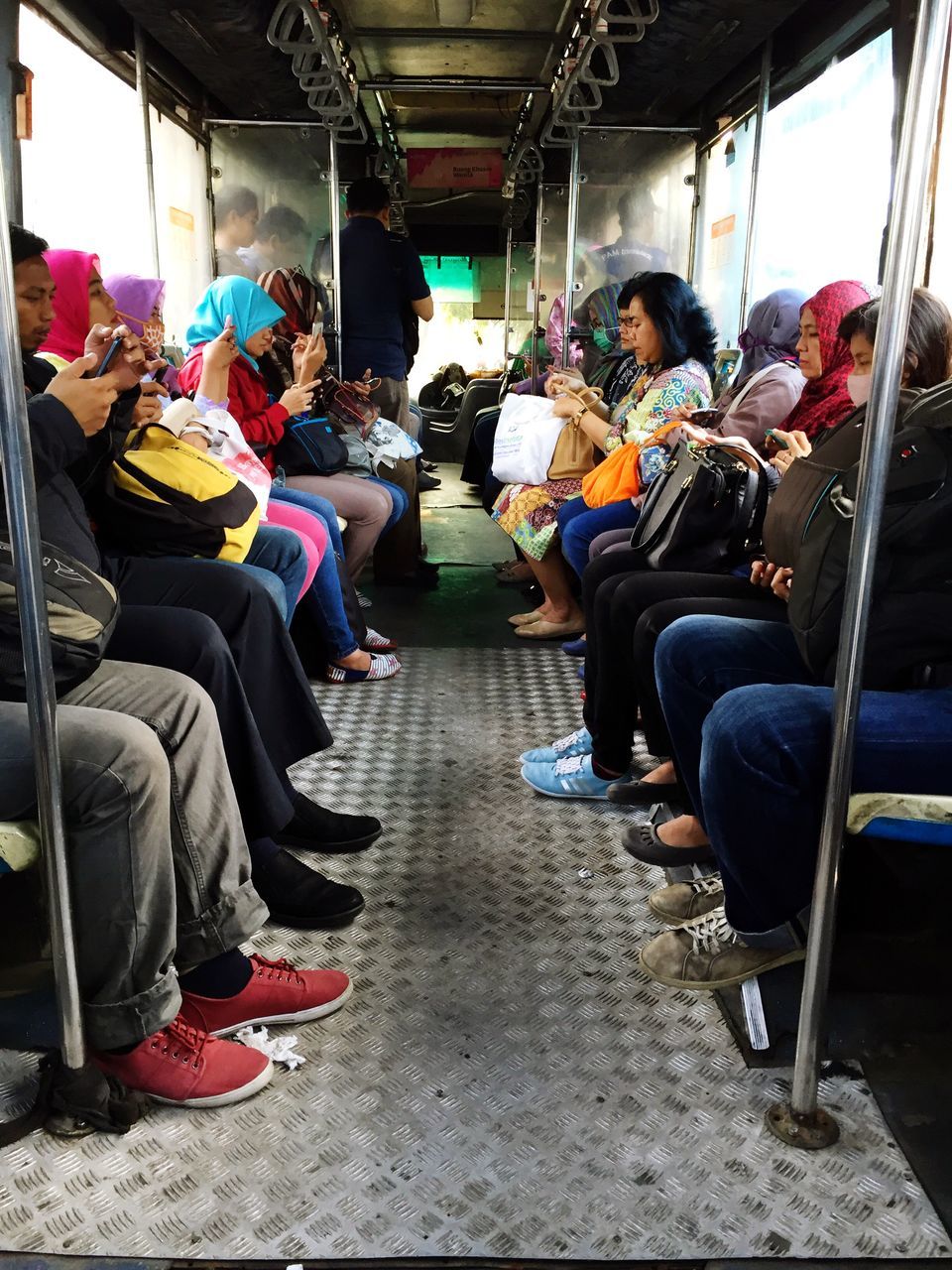 transportation, mode of transport, men, chair, indoors, person, sitting, land vehicle, empty, seat, travel, in a row, rear view, vehicle seat, lifestyles, day, absence, incidental people, large group of people