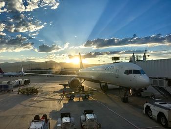 High angle view of airport runway against sky during sunset