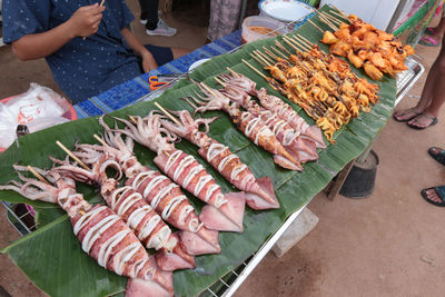 High angle view of man preparing food at market