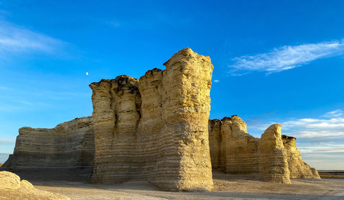 Rock formations on mountain against sky