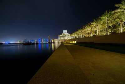 Illuminated buildings at waterfront