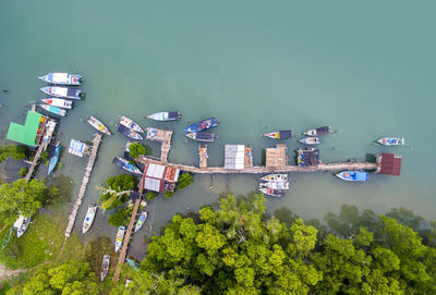 High angle view of boats moored at jetty