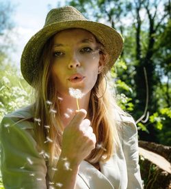 Portrait of young woman wearing hat