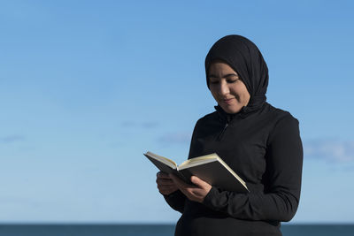 Young woman using mobile phone