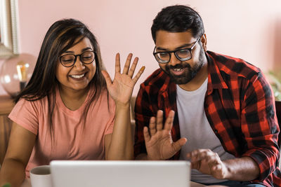 Young woman using laptop at home