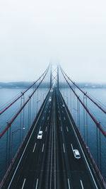 High angle view of bridge over sea during foggy weather