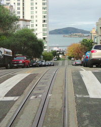 View of vehicles on street in city