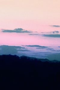 Scenic view of silhouette landscape against sky at sunset