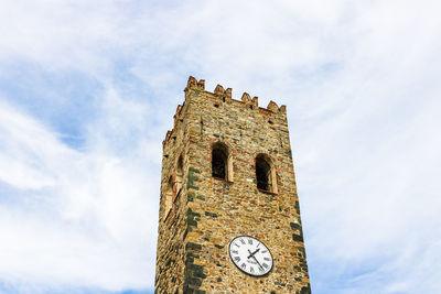 Low angle view of clock tower against sky