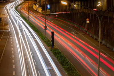 High angle view of light trails on highway at night