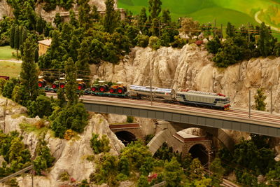 High angle view of cars on mountain by trees