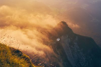 High angle view of land against sky during sunset