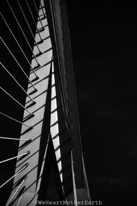 Low angle view of modern building against sky at night