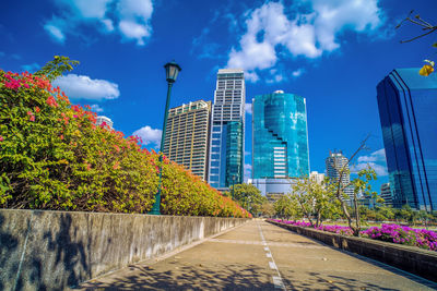 Modern buildings in city against sky