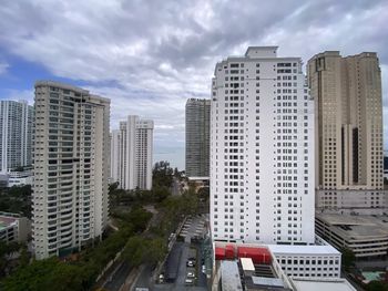 High angle view of buildings in city against sky