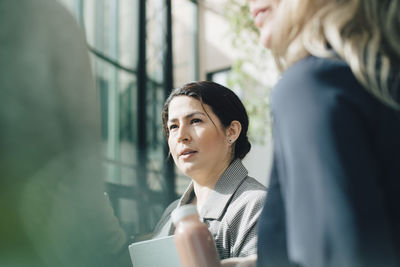 Mature businesswoman planning with team in conference meeting at office