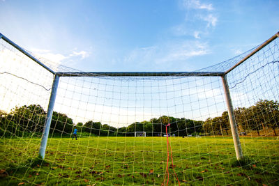 Scenic view of soccer field against sky