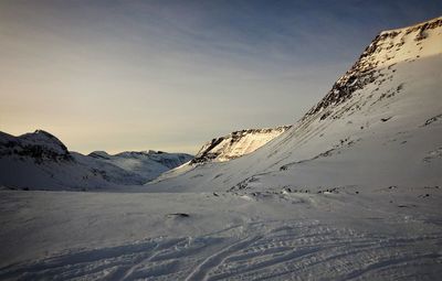 Scenic view of snow covered mountain against sky