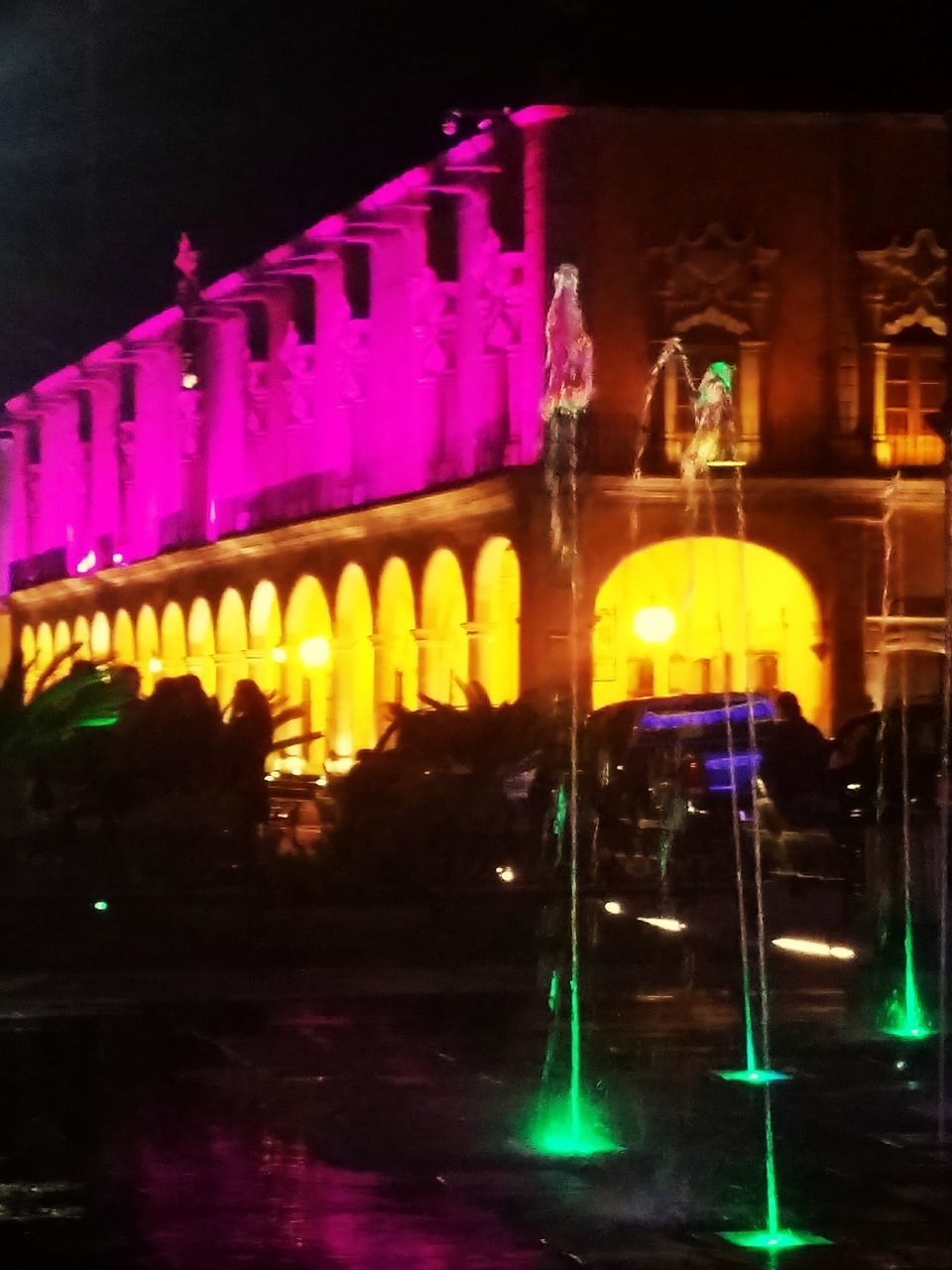 ILLUMINATED YELLOW BUILT STRUCTURE AT NIGHT