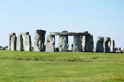 Built structure on field against clear sky