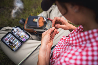 Midsection of woman using mobile phone